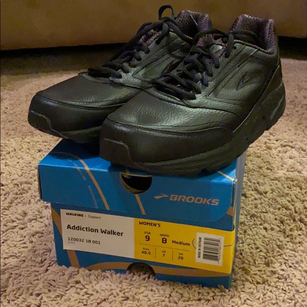Black leather Brooks walking shoe.
